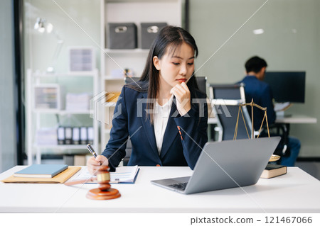 Asian woman lawyer working and gavel, tablet, laptop in front, Advice justice and law concept. Asian woman lawyer working and gavel, tablet, laptop in front, Advice justice and law concept. 121467066