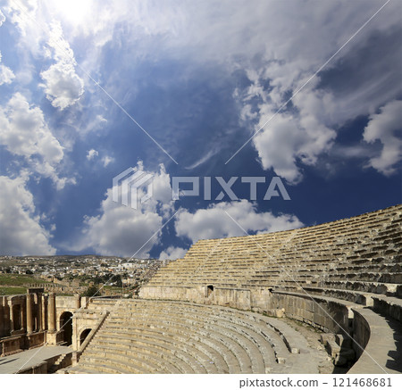 Amphitheater in Jerash (Gerasa of Antiquity), capital and largest city of Jerash Governorate, Jordan. Against the background of a beautiful sky with clouds Amphitheater in Jerash (Gerasa of Antiquity), capital and largest city of Jerash Governorate, Jordan. Against the background of a beautiful sky with clouds 121468681