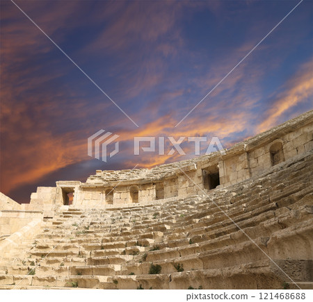 Amphitheater in Jerash (Gerasa of Antiquity), capital and largest city of Jerash Governorate, Jordan. Against the background of a beautiful sky with clouds 121468688