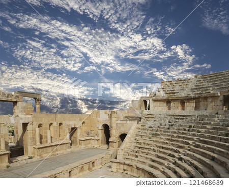 Amphitheater in Jerash (Gerasa of Antiquity), capital and largest city of Jerash Governorate, Jordan. Against the background of a beautiful sky with clouds 121468689