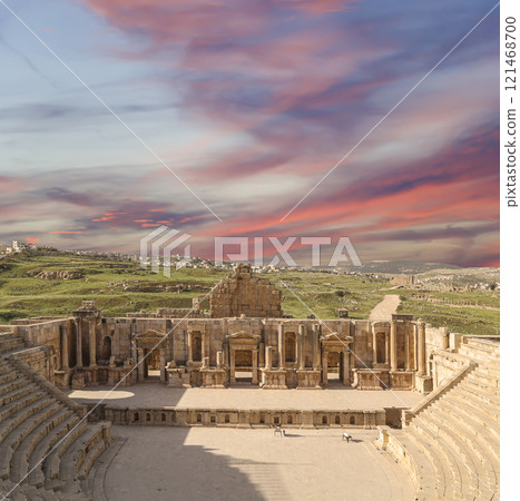 Amphitheater in Jerash (Gerasa of Antiquity), capital and largest city of Jerash Governorate, Jordan. Against the background of a beautiful sky with clouds 121468700