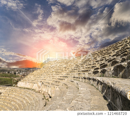 Amphitheater in Jerash (Gerasa of Antiquity), capital and largest city of Jerash Governorate, Jordan. Against the background of a beautiful sky with clouds Amphitheater in Jerash (Gerasa of Antiquity), capital and largest city of Jerash Governorate, Jordan. Against the background of a beautiful sky with clouds 121468720