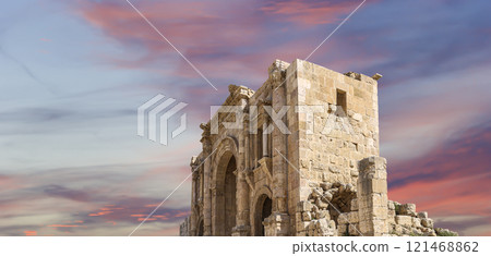 Arch of Hadrian in Gerasa (Jerash)-- was built to honor the visit of emperor Hadrian to Jerash in 129/130 AD, Jordan. Against the background of a beautiful sky with clouds Arch of Hadrian in Gerasa (Jerash)-- was built to honor the visit of emperor Hadrian to Jerash in 129/130 AD, Jordan. Against the background of a beautiful sky with clouds 121468862