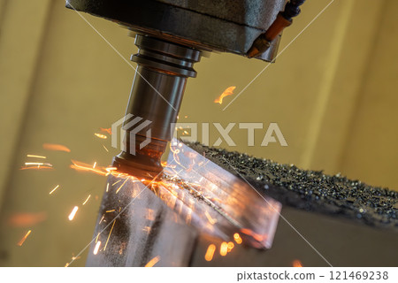 The burning chip from wear cutting tools on CNC milling machine. The burning chip from wear cutting tools on CNC milling machine. 121469238