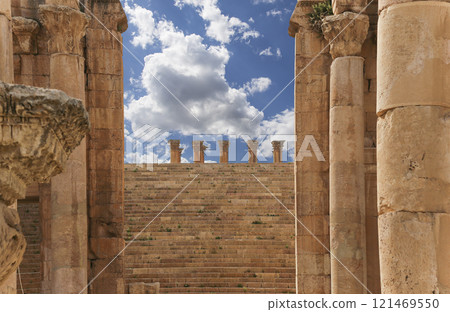 Roman ruins (against the background of a beautiful sky with clouds) in the Jordanian city of Jerash (Gerasa of Antiquity), capital and largest city of Jerash Governorate, Jordan 121469550
