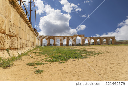 Roman ruins (against the background of a beautiful sky with clouds) in the Jordanian city of Jerash (Gerasa of Antiquity), capital and largest city of Jerash Governorate, Jordan Roman ruins (against the background of a beautiful sky with clouds) in the Jordanian city of Jerash (Gerasa of Antiquity), capital and largest city of Jerash Governorate, Jordan 121469579