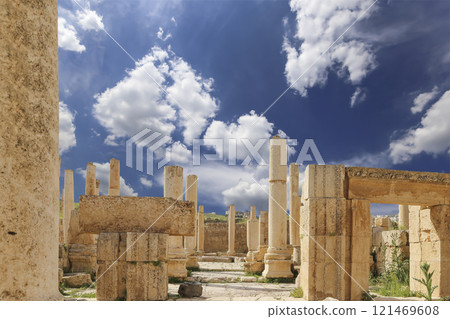 Roman ruins (against the background of a beautiful sky with clouds) in the Jordanian city of Jerash (Gerasa of Antiquity), capital and largest city of Jerash Governorate, Jordan Roman ruins (against the background of a beautiful sky with clouds) in the Jordanian city of Jerash (Gerasa of Antiquity), capital and largest city of Jerash Governorate, Jordan 121469608