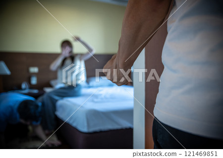 A man who discovered his wife cheating clenching his fist, adultery, the other man, kneeling down to apologize A man who discovered his wife cheating clenching his fist, adultery, the other man, kneeling down to apologize 121469851