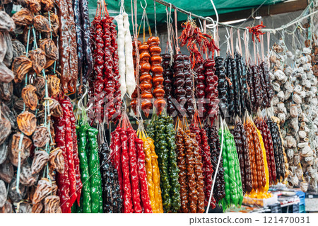 Churchkhela made from nuts hangs at a local market. 121470031