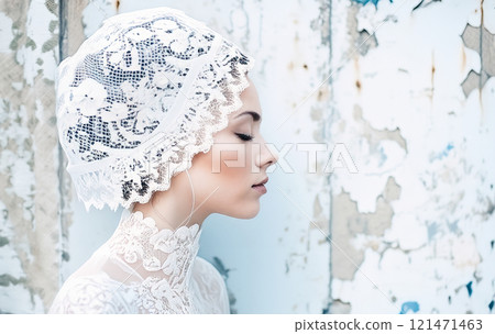 The image features a woman dressed in a vintage-style bridal look,complete with a white lacy corset and a decorative headpiece,set against a gritty, urban background 121471463