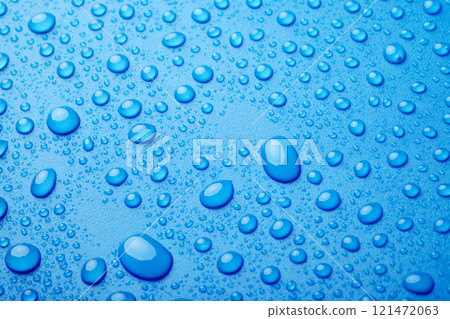Blue water drops background 121472063