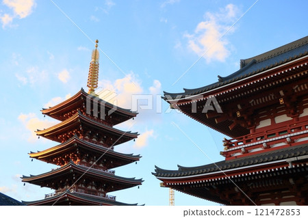 The five-story pagoda of Sensoji Temple shining golden in the sunset 121472853