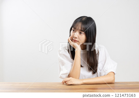 A young woman thinking about something 121473163