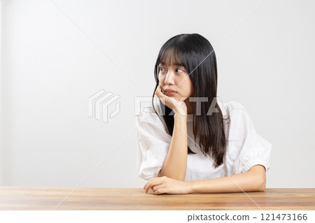 A young woman thinking about something 121473166