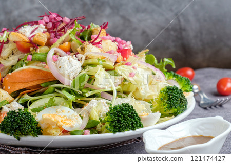 Healthy Salad Bowl, Colorful Vegetables With sauce Healthy Salad Bowl, Colorful Vegetables With sauce 121474427