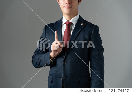 Middle-aged male lawyer point 121474457
