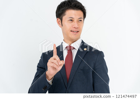 Middle-aged male lawyer pointing 121474497