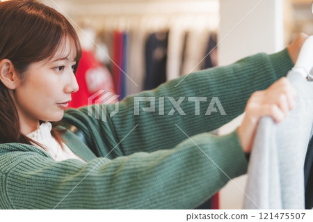 A woman choosing clothes at a shopping mall (Photo courtesy of Nuttari Terrace Shopping Street) 121475507