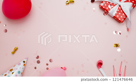 Concept of festive birthday celebrations. Birthday attributes colorful balloons, party hats, candles, confetti 121476646
