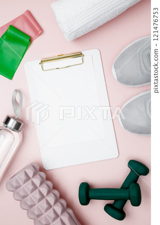Healthy lifestyle, sport equipment, dumbbells, foam roller for Myofascial release and mock up clipboard 121476753
