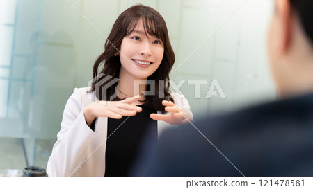 Smiling woman/businesswoman having a conversation 121478581