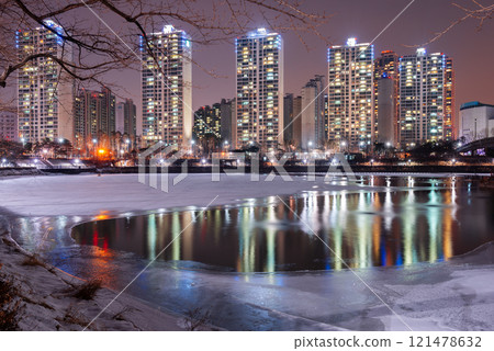 Seoul, South Korea winter pond and residential high rises at night. Seoul, South Korea winter pond and residential high rises at night. 121478632