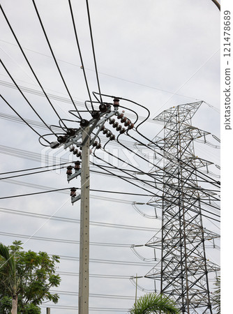 porcelain insulator on High voltage post, High voltage tower, show with high voltage construction and power lines. porcelain insulator on High voltage post, High voltage tower, show with high voltage construction and power lines. 121478689