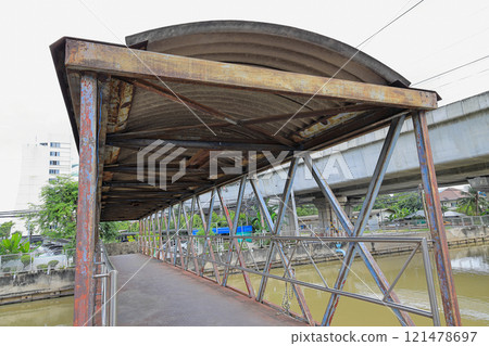 An old bridge, walkway, or passageway that connects the canal's building banks. An old bridge, walkway, or passageway that connects the canal's building banks. 121478697