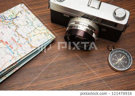 Travel image: camera, map, compass, direction magnet 121478916