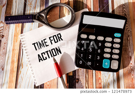 A notebook labeled Time to act. The concept of urgency and the need for action 121478973
