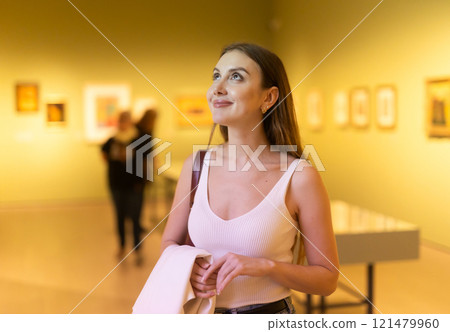 Girl view pictures and icons in museum hall Girl view pictures and icons in museum hall 121479960
