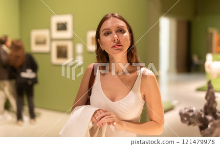 Woman at the Photo Exhibition Woman at the Photo Exhibition 121479978