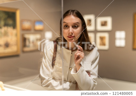 Girl view sculpture in museum hall 121480005