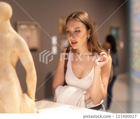 Girl view sculpture in museum hall Girl view sculpture in museum hall 121480027