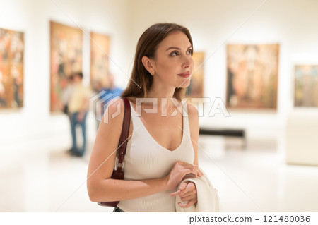 Girl view pictures and icons in museum hall Girl view pictures and icons in museum hall 121480036