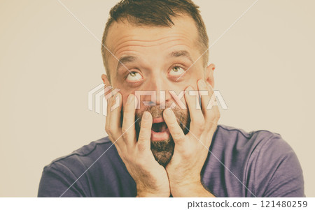 Scared adult man Scared adult man 121480259