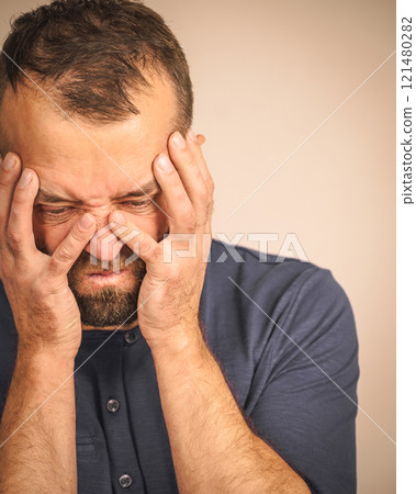 Worried man gesturing with hands 121480282