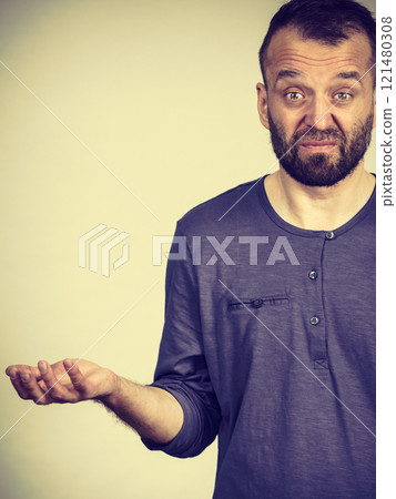 Confused adult man seeking for solution 121480308
