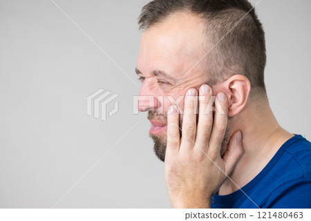 Man having tooth pain 121480463