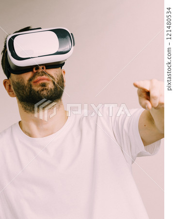 Adult man wearing vr goggles Adult man wearing vr goggles 121480534