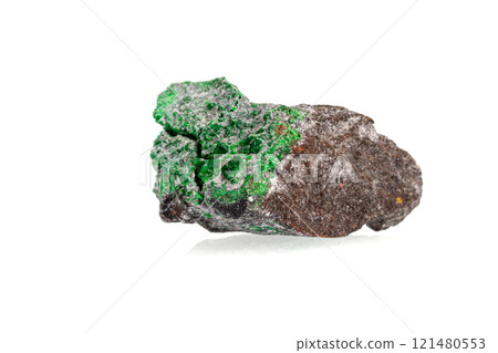 macro stone mineral uvarovite on a white background macro stone mineral uvarovite on a white background 121480553