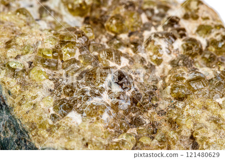 macro mineral stone grossular on a white background macro mineral stone grossular on a white background 121480629