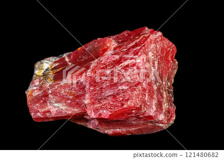 macro mineral Rhodonite stone on a black background macro mineral Rhodonite stone on a black background 121480682