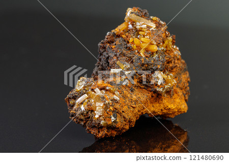 macro mineral Wulfenite stone on a black background macro mineral Wulfenite stone on a black background 121480690