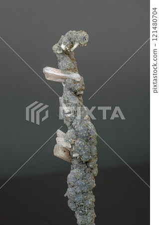 Macro mineral stone chalcedony with stelbite on a gray background Macro mineral stone chalcedony with stelbite on a gray background 121480704