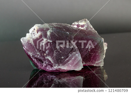 macro mineral stone red and green fluorite on a black background macro mineral stone red and green fluorite on a black background 121480709