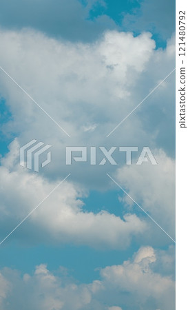 Cloud Background Summer. Beauty White Cloudy On Blue Sky With Soft Sun Light. Sky Replacement. Vertical Time Lapse. Cloud Background Summer. Beauty White Cloudy On Blue Sky With Soft Sun Light. Sky Replacement. Vertical Time Lapse. 121480792