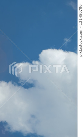 Sky Blue Or Azure Sky And Clouds. Soft White Clouds On Pastel Blue Sky Background. Vertical Time Lapse. Sky Blue Or Azure Sky And Clouds. Soft White Clouds On Pastel Blue Sky Background. Vertical Time Lapse. 121480796