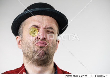 Man having bitcoin in eye Man having bitcoin in eye 121480876