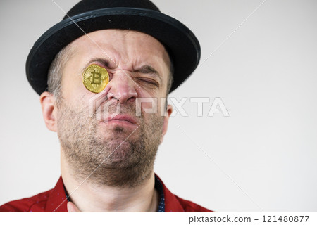 Man having bitcoin in eye Man having bitcoin in eye 121480877